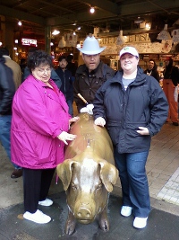 My family petting Rachel at Pike's Place